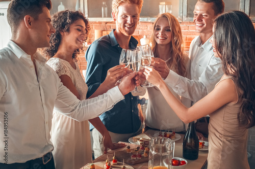 Group of friends party together indoors celebration