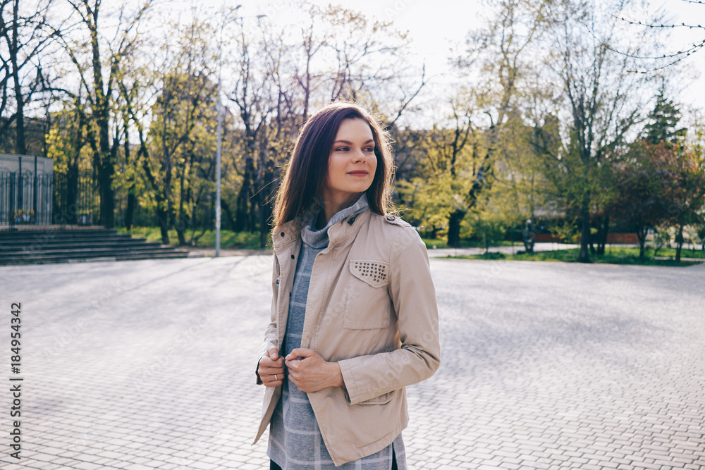 Slender woman in a beige jacket Slender woman in a beige jacket