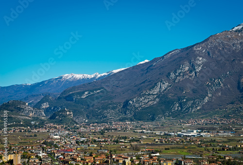 Beautiful panoramic view on the snowy mountains near Lake Garda and Arco Castle, Italy © Юлия Мальсагова
