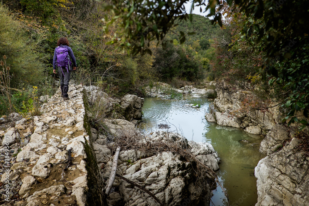 Montecatini Val di Cecina, Pisa, Italy - November 7, 2017: It is an itinerary in the Monterufoli Nature Reserve, monumental great work are the stone bridges Montecatini Val di Cecina, Pisa, Italy - November 7, 2017: It is an itinerary in the Monterufoli Nature Reserve, monumental great work are the stone bridges