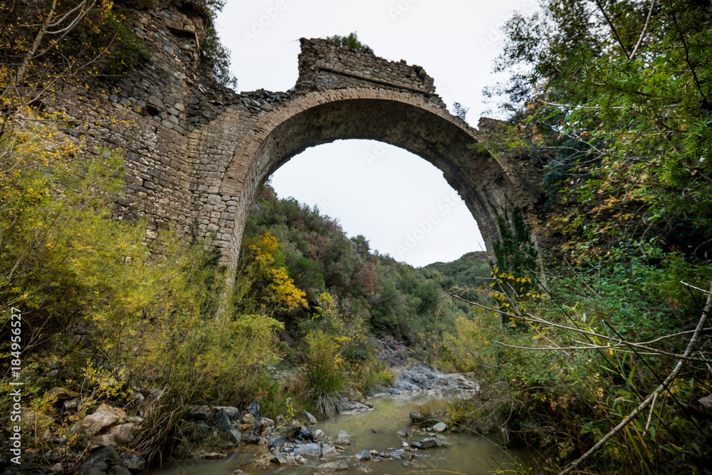 Montecatini Val di Cecina, Pisa, Italy - November 7, 2017: It is an itinerary in the Monterufoli Nature Reserve, monumental great work are the stone bridges