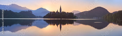 Church and Castle in lake Bled, Slovenia at sunset, scenic summer panorama