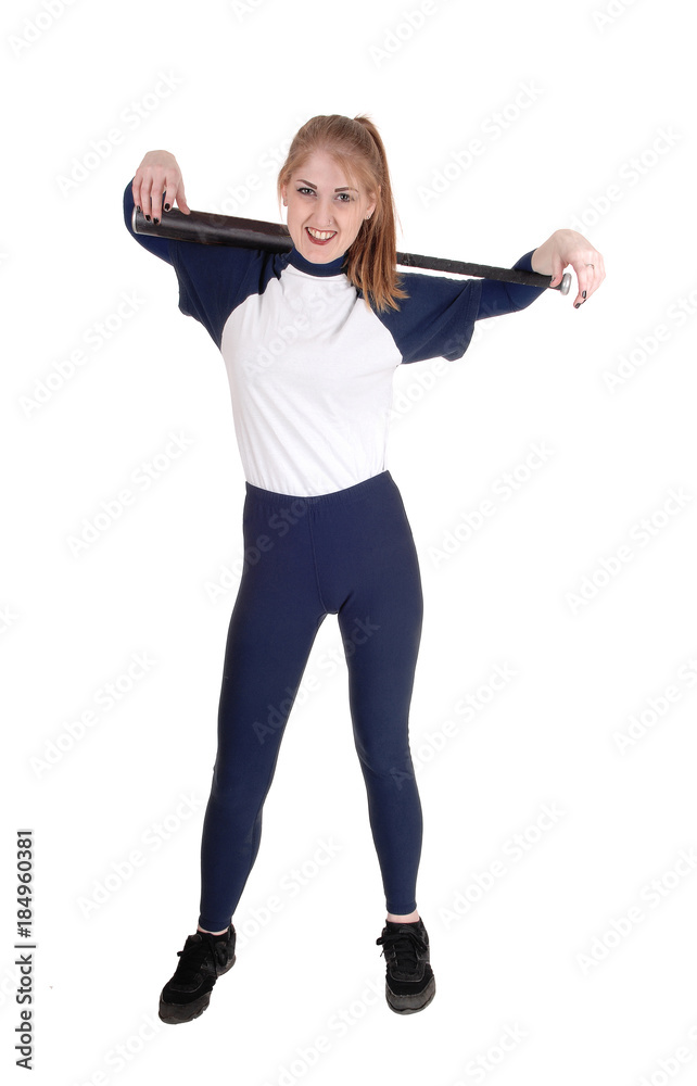 Woman holding her softball bat over her shoulder Woman holding her softball bat over her shoulder