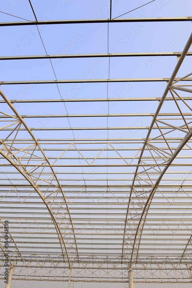 Fototapeta premium Steel structure workshop roof is under construction