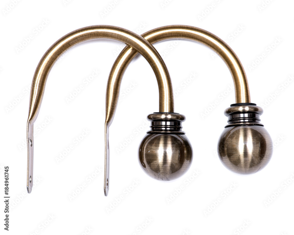 Brass ball window curtain holdback pair isolated on white background Brass ball window curtain holdback pair isolated on white background