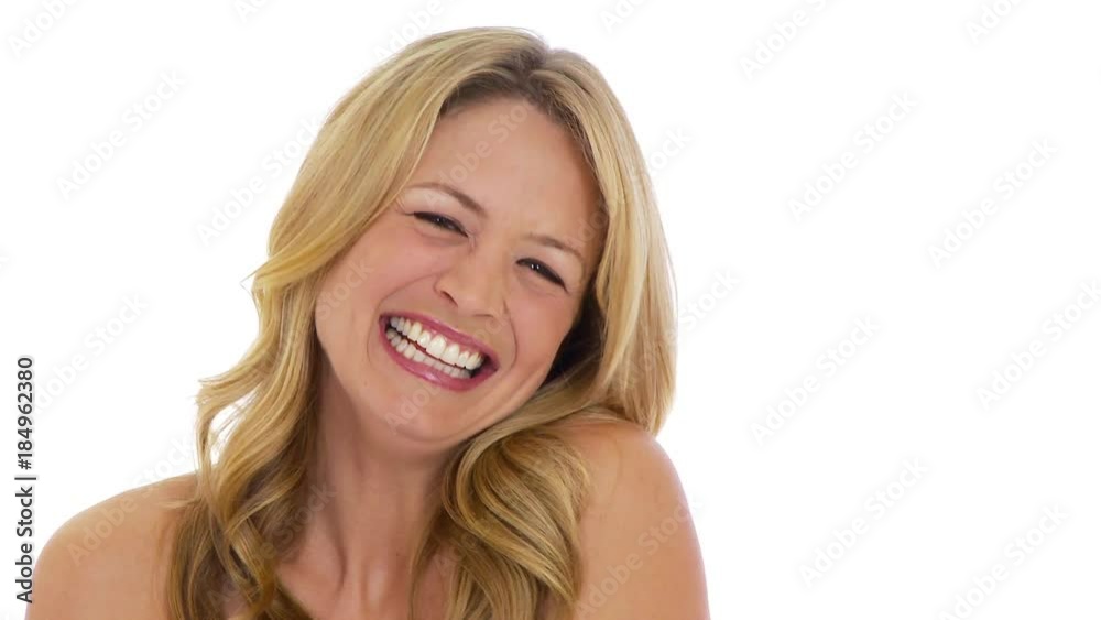 Young woman laughing on white background Young woman laughing on white background