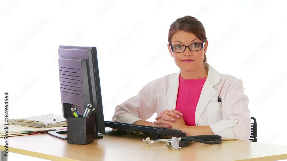 Young woman in labcoat working at desk Young woman in labcoat working at desk