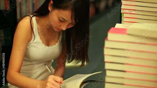 young asian woman in the bookshop