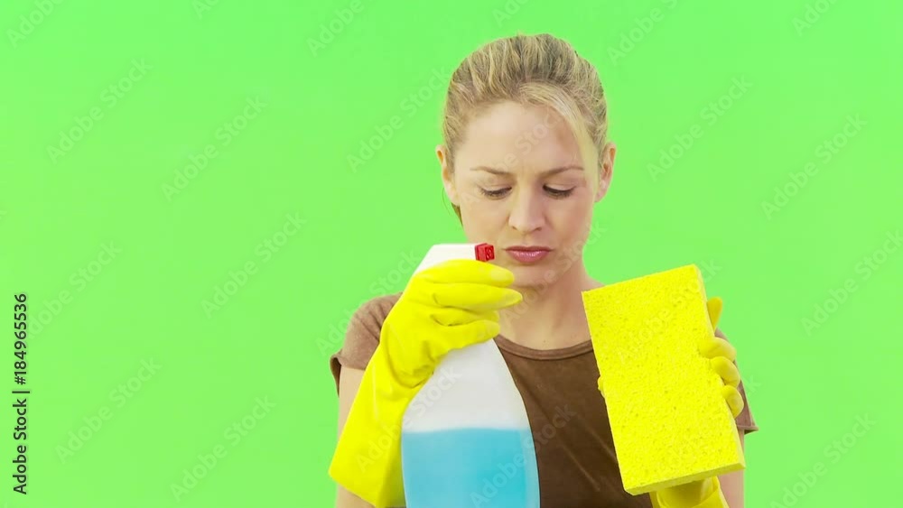 Close up of woman with sponge and spray bottle Close up of woman with sponge and spray bottle
