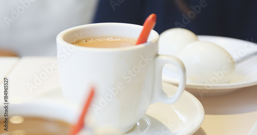 Stirring coffee in restaurant