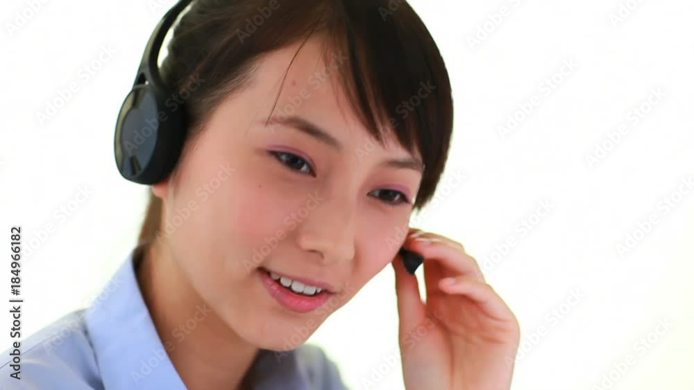 close up of young asian customer service at work close up of young asian customer service at work