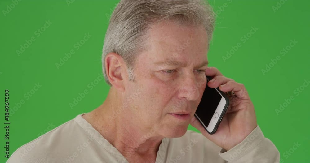 Mid aged caucasian man on a cellphone Mid aged caucasian man on a cellphone