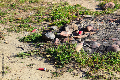 Shot gun shells around a hunting campfire pit