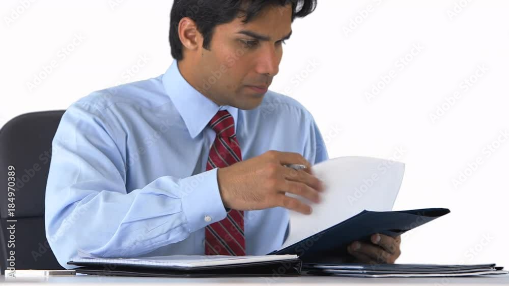 confident businessman sitting at his desk on greenscreen confident businessman sitting at his desk on greenscreen