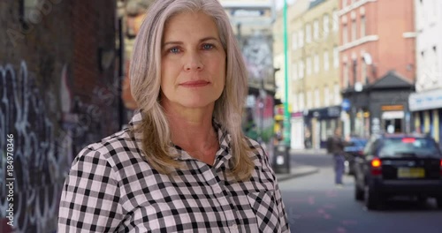 Wallpaper Mural Stern white female looks with coldness on a sidewalk in London Torontodigital.ca