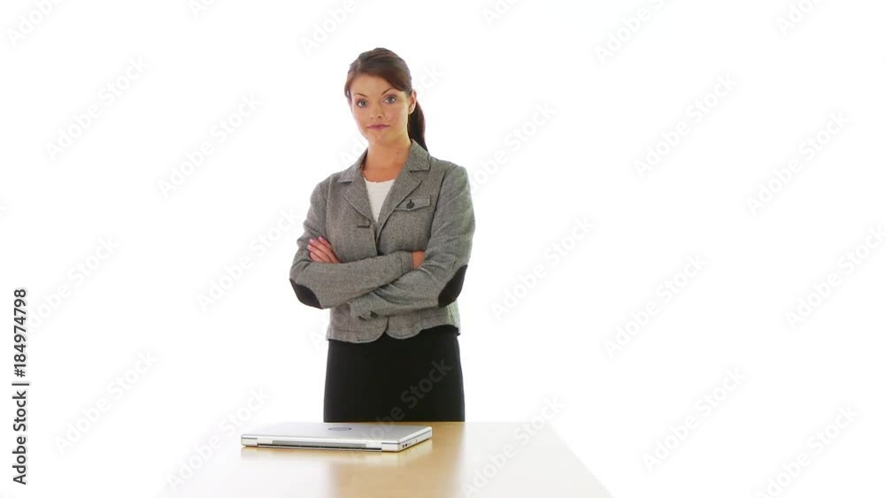 Businesswoman standing at the end of a table Businesswoman standing at the end of a table