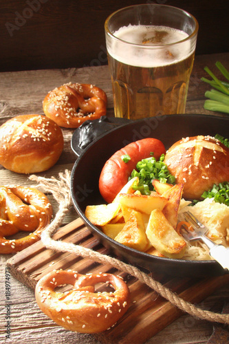 pretzels with sesame seeds and salt, fried cabbage, potatoes, shpikachki and beer