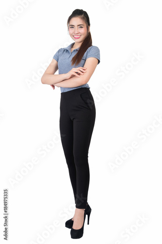 Smiling young woman in gray polo shirt with arms crossed on a white background