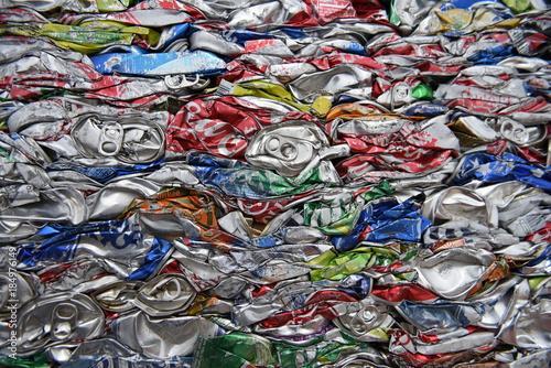 Smashed, crushed, compressed aluminum beverage cans, scrap metal recycling.