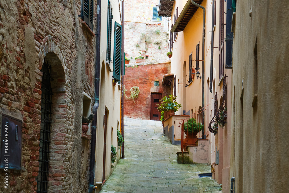 Montepuliciano old city characteristic medieval narrow street, Tuscany, Italy