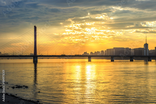 River and city skyline scenery at sunset