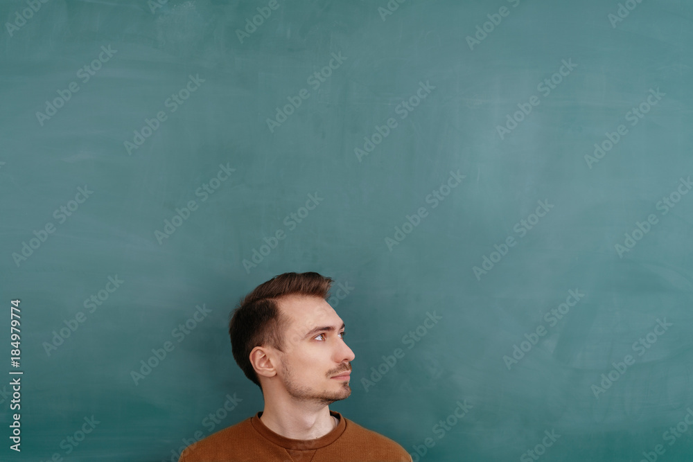 Young bearded man looking to the side Young bearded man looking to the side
