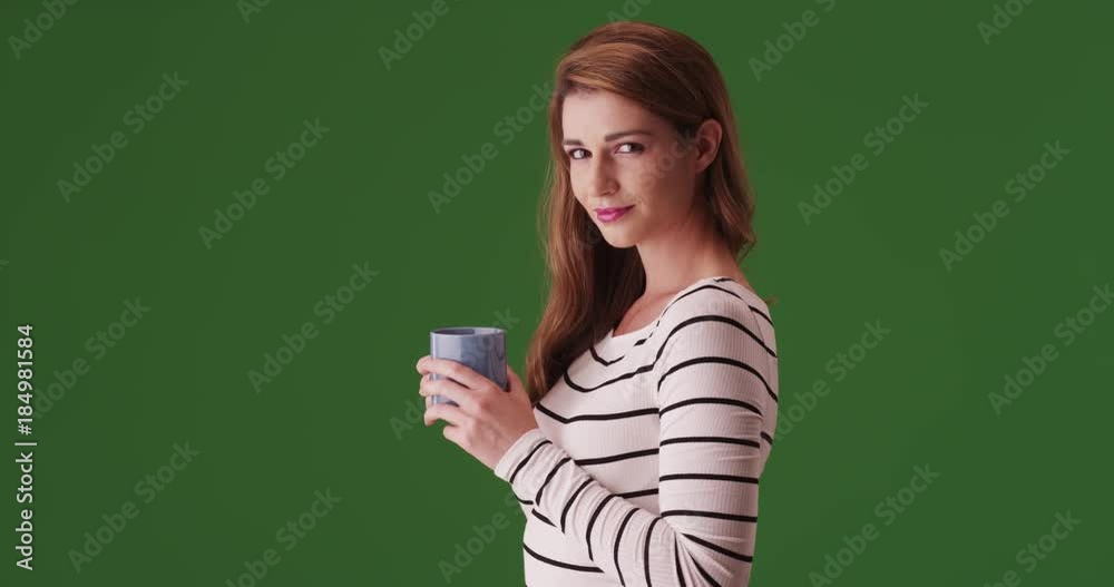 Attractive woman looking at camera on green screen. On green screen to be keyed or composited. Attractive woman looking at camera on green screen. On green screen to be keyed or composited.