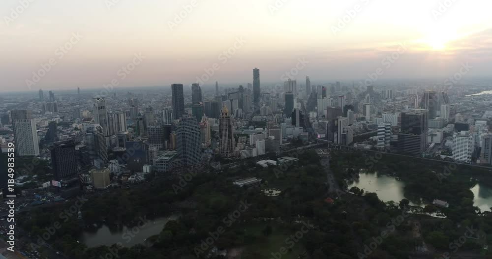 BANGKOK, THAILAND, MARCH 2017: Aerial view over Central Bangkok and Lumpini park at sunset BANGKOK, THAILAND, MARCH 2017: Aerial view over Central Bangkok and Lumpini park at sunset