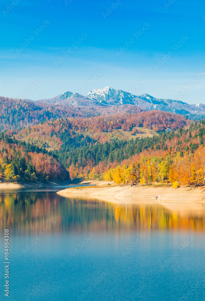      Panoramic view of Lokvarsko lake with Risnjak mountain in background, beautiful colorful mountain autumn landscape, Lokve, Gorski kotar, Croatia 