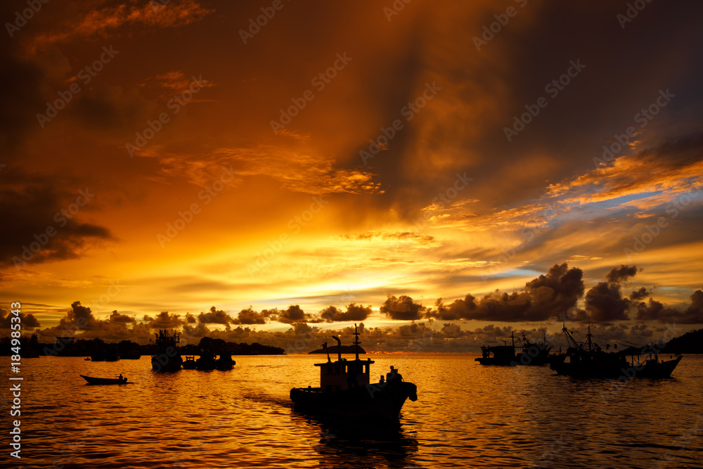 Home coming fishing boat at sunset in Kota Kinabalu in Sabah Malaysia