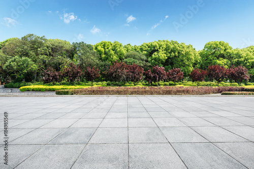 Empty city square floor and green forest nature landscape