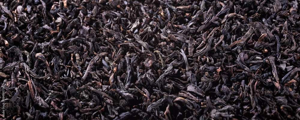 Background with black tea with copy space. Selective focus. Banner. Background with black tea with copy space. Selective focus. Banner.