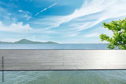 Outdoor viewing platform and lake landscape under the blue sky