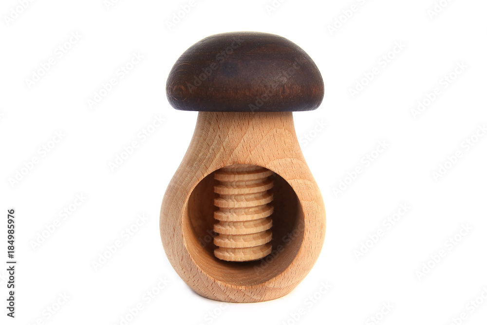 Wooden mushroom shape nutcracker isolated on white background. Screw type nut cracker. Wooden mushroom shape nutcracker isolated on white background. Screw type nut cracker.