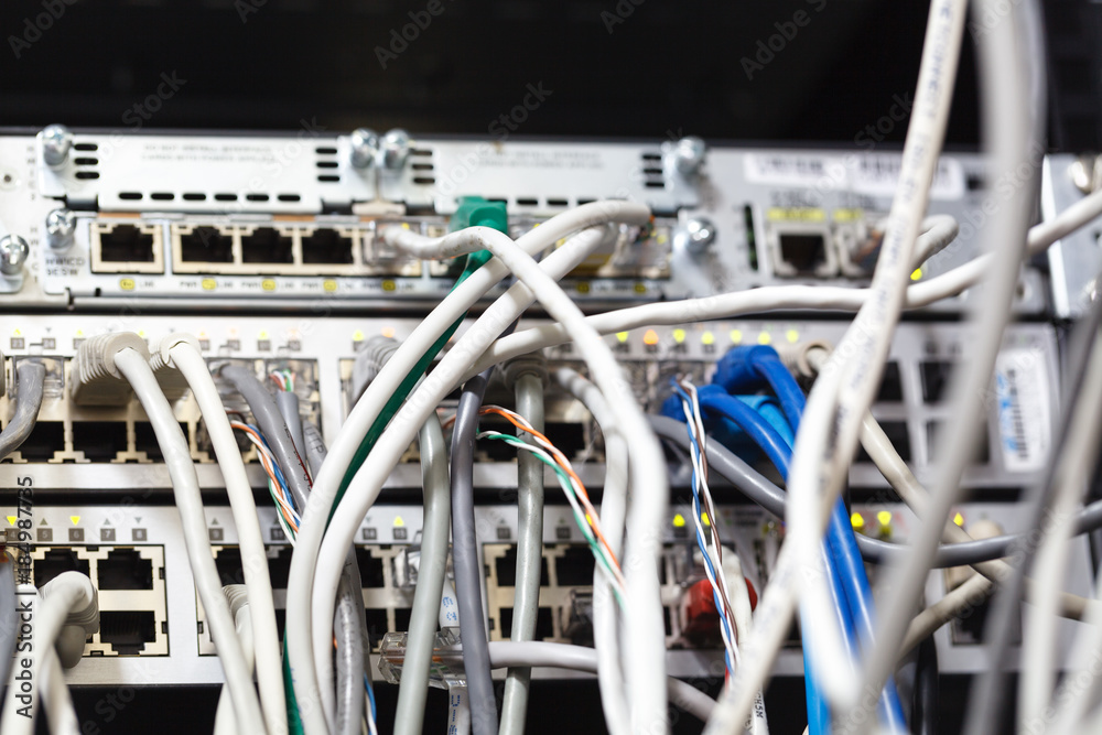 Patch Panel server rack with gray cords in the background