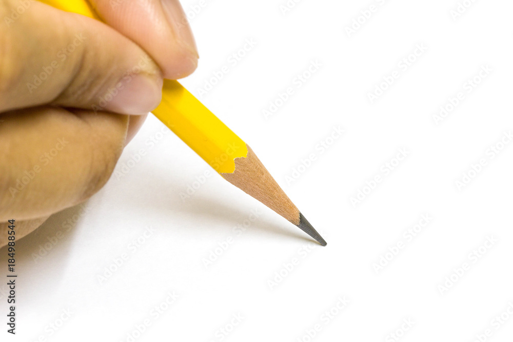 Close up hand of a female holding a Yellow Pencil isolated on white background with copy space Close up hand of a female holding a Yellow Pencil isolated on white background with copy space