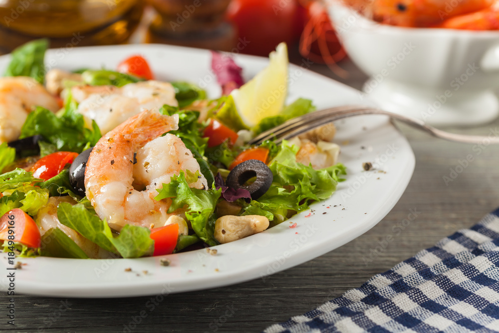 Shrimp salad with tomato, olives and cashew nuts. Shrimp salad with tomato, olives and cashew nuts.