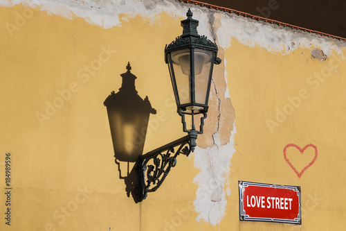Street love. Wall with lamp and heart. Prague