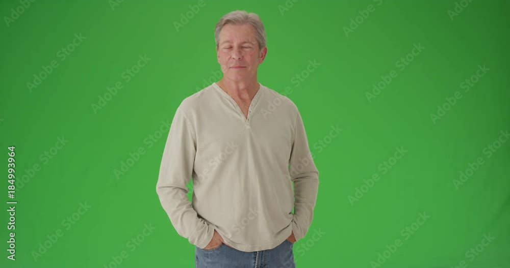 Mature senior white man looking around green screen Mature senior white man looking around green screen