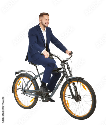 Young handsome businessman with bicycle on white background