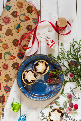 Mincemeat pies. Christmas decorations. Cranberries. White background.