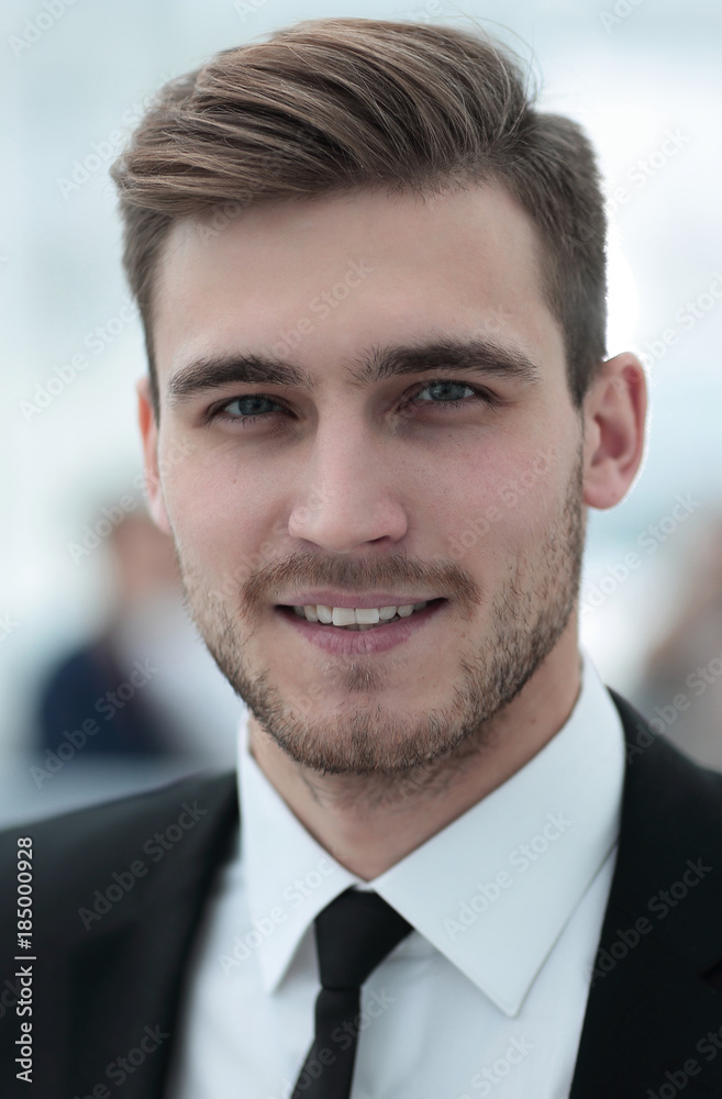 successful businessman on blurred background. successful businessman on blurred background.