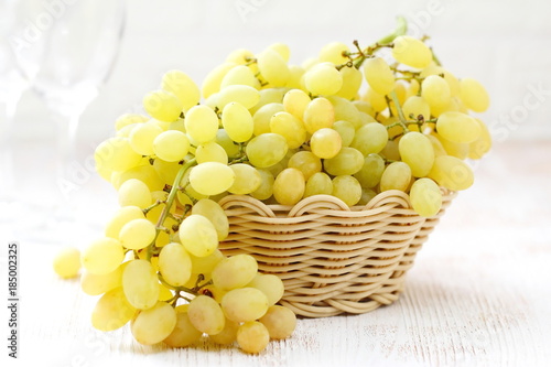 Grapes in a basket on a table