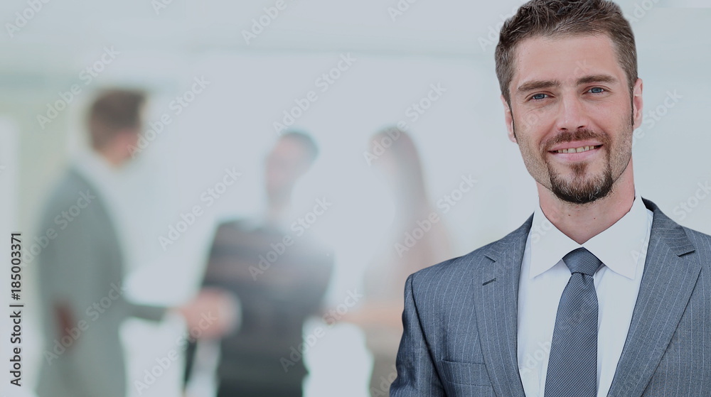Fototapeta premium Happy mature business man looking at camera with satisfaction at office