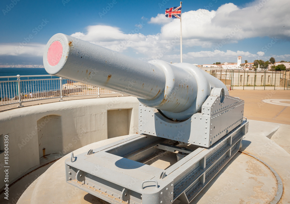 Cannon on Gibraltar Europa Point with British flag in background