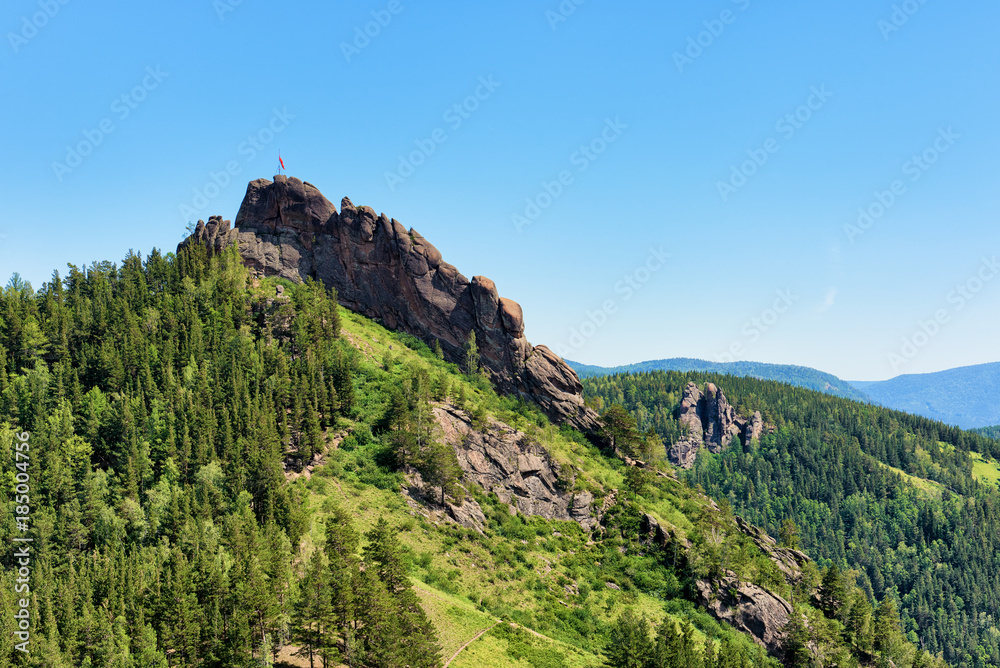 Takmak rock massif. Fanciful rocks in June afternoon. Stolby Nature Sanctuary (Pillars). Krasnoyarsk region. Russia