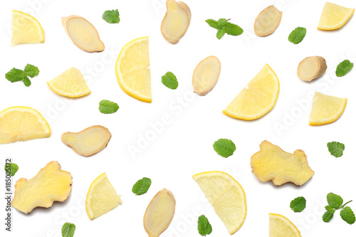 Fototapeta Naklejka Na Ścianę i Meble -  healthy background. sliced ginger and lemon isolated on white background top view