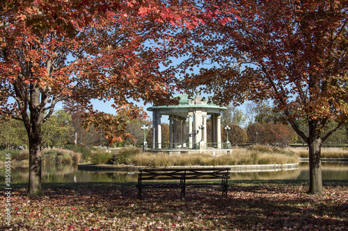 Music Pagoda bandstand on Pagoda Lake in Forest Park St Louis Missouri during fall, red leaves on trees