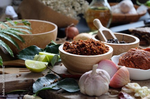 Assortment of Thai food Cooking ingredients. Spices ingredients chilli pepper garlicgalanga and kaffir lime leaves.