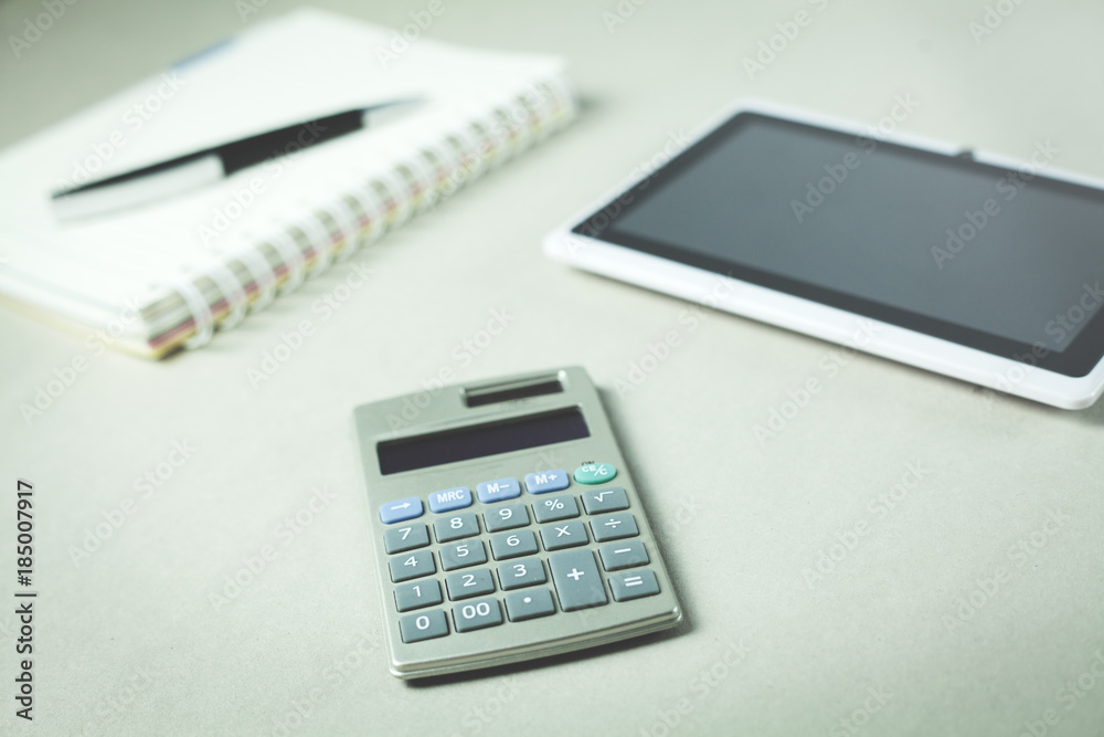 Notepad with tablet and calculator. Business concept. Notepad with tablet and calculator. Business concept.